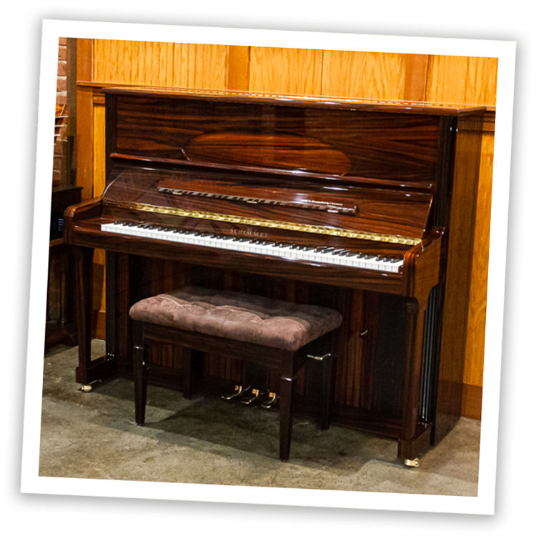 Elegant wooden upright piano with cushioned stool, perfect for music enthusiasts and home decor.