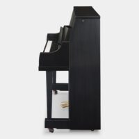 Side view of a black upright piano with brass pedals on a white background.