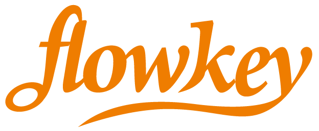 Orange script logo of flowkey, a piano learning platform.