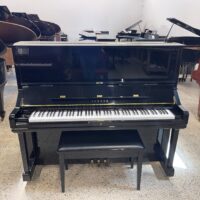 Yamaha upright piano in polished ebony finish, featuring a classic design and responsive touch for superior performance.