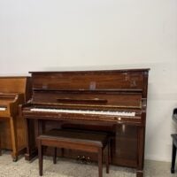 Classic upright piano in mahogany finish with elegant design, paired with a matching padded bench for comfort and style.